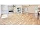 Open living area featuring a fireplace, modern lighting, and access to outdoor space at 622 Glascock St, Raleigh, NC 27604
