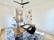 Home office with hardwood floors, ceiling fan, modern desk, and built-in shelving for storage and display at 622 Glascock St, Raleigh, NC 27604
