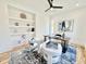 Office boasts modern desk, built-in shelving, ceiling fan, hardwood floors, and comfortable seating for clients at 622 Glascock St, Raleigh, NC 27604