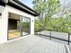 Relax on the outdoor patio with pavers, glass sliding door access to interior, and landscape views at 622 Glascock St, Raleigh, NC 27604