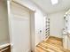 Well-organized walk-in closet featuring custom shelves and storage solutions with wood floor at 622 Glascock St, Raleigh, NC 27604