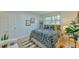 Bedroom with hardwood floors, natural light, and stylish decor offers a comfortable and aesthetically pleasing retreat at 775 Old Graham Rd, Pittsboro, NC 27312