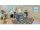 Bedroom with hardwood floors, natural light, and tasteful decor provides a serene and inviting space for rest at 775 Old Graham Rd, Pittsboro, NC 27312
