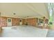 Spacious carport with brick columns and convenient access to doors at 775 Old Graham Rd, Pittsboro, NC 27312