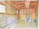Shed interior showcasing ample storage with window, shelving, and unfinished walls at 775 Old Graham Rd, Pittsboro, NC 27312