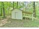 Exterior of shed with awning and wooden door and frame at 775 Old Graham Rd, Pittsboro, NC 27312