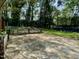 Backyard features a concrete patio and mature trees at 810 Nancy St, Durham, NC 27701