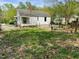 Backyard view highlighting planting beds and detached structure at 810 Nancy St, Durham, NC 27701