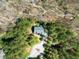 An aerial view of a home with driveway and wooded property at 83 Calabria Ct, Clayton, NC 27527