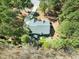 Aerial view of a secluded home surrounded by lush trees, offering privacy at 83 Calabria Ct, Clayton, NC 27527