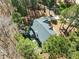 Drone shot showcasing a roof and backyard surrounded by natural tree coverage at 83 Calabria Ct, Clayton, NC 27527