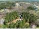 A beautiful aerial view of a home nestled among lush trees at 83 Calabria Ct, Clayton, NC 27527