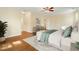 Spacious bedroom features hardwood floors, a ceiling fan, and a calming color scheme at 83 Calabria Ct, Clayton, NC 27527