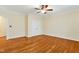 The bedroom has hardwood floors, a ceiling fan and double doors to the closet at 83 Calabria Ct, Clayton, NC 27527
