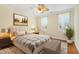 Serene bedroom with neutral decor, hardwood floors, and a ceiling fan for added comfort at 83 Calabria Ct, Clayton, NC 27527