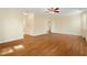 Large bedroom featuring hardwood floors and a ceiling fan, with a neutral color palette at 83 Calabria Ct, Clayton, NC 27527