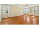 Sunlit bedroom with hardwood floors, recessed lighting, and multiple windows offering natural light at 83 Calabria Ct, Clayton, NC 27527