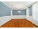 Dining room boasts classic trim, modern chandelier, and hardwood floors at 83 Calabria Ct, Clayton, NC 27527