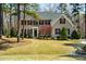 Traditional brick home with manicured lawn and landscaping at 83 Calabria Ct, Clayton, NC 27527