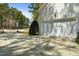 Exterior view of the garage, showing its white siding and the driveway leading up to it at 83 Calabria Ct, Clayton, NC 27527