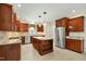 Well-equipped kitchen featuring stainless steel appliances, custom cabinets, and a functional center island at 83 Calabria Ct, Clayton, NC 27527