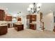 Spacious kitchen with stainless steel appliances, granite countertops, and a large center island at 83 Calabria Ct, Clayton, NC 27527