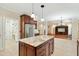 Bright kitchen with stainless steel appliances, ample counter space, and an adjacent area with butterfly wall decals at 83 Calabria Ct, Clayton, NC 27527