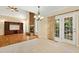 Open concept floor plan with the living room and kitchen sharing tile and hardwood flooring at 83 Calabria Ct, Clayton, NC 27527