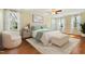 Bright bedroom with large windows, neutral decor, and a plush bed at 83 Calabria Ct, Clayton, NC 27527