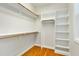 Spacious walk-in closet with built-in shelves and ample storage space, perfect for organizing your wardrobe and accessories at 83 Calabria Ct, Clayton, NC 27527