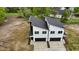 Aerial view of new construction duplex featuring garages and modern design at 834 Day Ave, Burlington, NC 27217