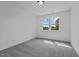 Bright bedroom with two windows and plush gray carpet for a cozy and inviting space at 834 Day Ave, Burlington, NC 27217