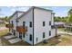 Rear exterior view of the modern two-story house featuring wood decks on the second story at 834 Day Ave, Burlington, NC 27217