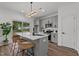 Modern kitchen featuring gray cabinets, quartz countertops, stainless steel appliances, and island at 834 Day Ave, Burlington, NC 27217