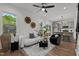 Open-concept living room featuring modern furnishings, wood floors, and natural light at 834 Day Ave, Burlington, NC 27217