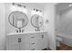 Modern bathroom with double vanity sinks, matching mirrors, and sleek black hardware at 836 Day Ave, Burlington, NC 27217