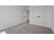 Bedroom with double closets, plush gray carpet and open doorway at 836 Day Ave, Burlington, NC 27217