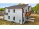 Exterior shot of the back of the home with walkout basement and a balcony at 836 Day Ave, Burlington, NC 27217