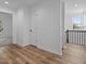 Upstairs hallway with natural light and view of trees through the windows at 836 Day Ave, Burlington, NC 27217