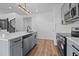 Bright kitchen featuring stainless steel appliances, modern lighting and gray cabinets at 836 Day Ave, Burlington, NC 27217