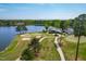 Breathtaking aerial view of a golf course alongside a serene lake and clubhouse at 8409 Muirfield Dr, Fuquay Varina, NC 27526