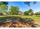 Spacious backyard with lush greenery, mature trees, and a charming two-story home at 8409 Muirfield Dr, Fuquay Varina, NC 27526