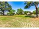 Sprawling backyard with manicured lawn and picturesque views of the surrounding neighborhood at 8409 Muirfield Dr, Fuquay Varina, NC 27526