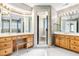 The bathroom has a standalone shower, vanities, and statement wallpaper at 8409 Muirfield Dr, Fuquay Varina, NC 27526