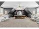 Spacious game room with a pool table, seating and an arched window at 8409 Muirfield Dr, Fuquay Varina, NC 27526