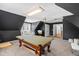Upstairs game room with pool table and couches at 8409 Muirfield Dr, Fuquay Varina, NC 27526