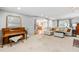 Inviting living room with piano and comfortable white sofa at 8409 Muirfield Dr, Fuquay Varina, NC 27526