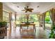 Sunroom with a wooden dining table, neutral colors and a view of the yard at 8409 Muirfield Dr, Fuquay Varina, NC 27526