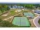 Aerial view of community tennis courts, golf course, and lake view at 8409 Muirfield Dr, Fuquay Varina, NC 27526