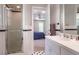 Bathroom with tiled shower and vanity, leading into a bedroom at 910 Old Orchard Rd, Chapel Hill, NC 27517
